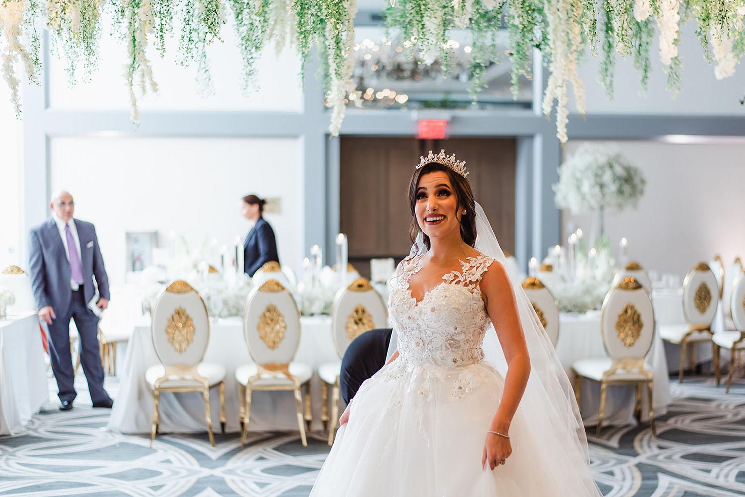 Wisteria, Baby's Breath, reception decor, omni houston, wedding decor, florist in houston, gold round table, mirror seating chart, wedding cake
