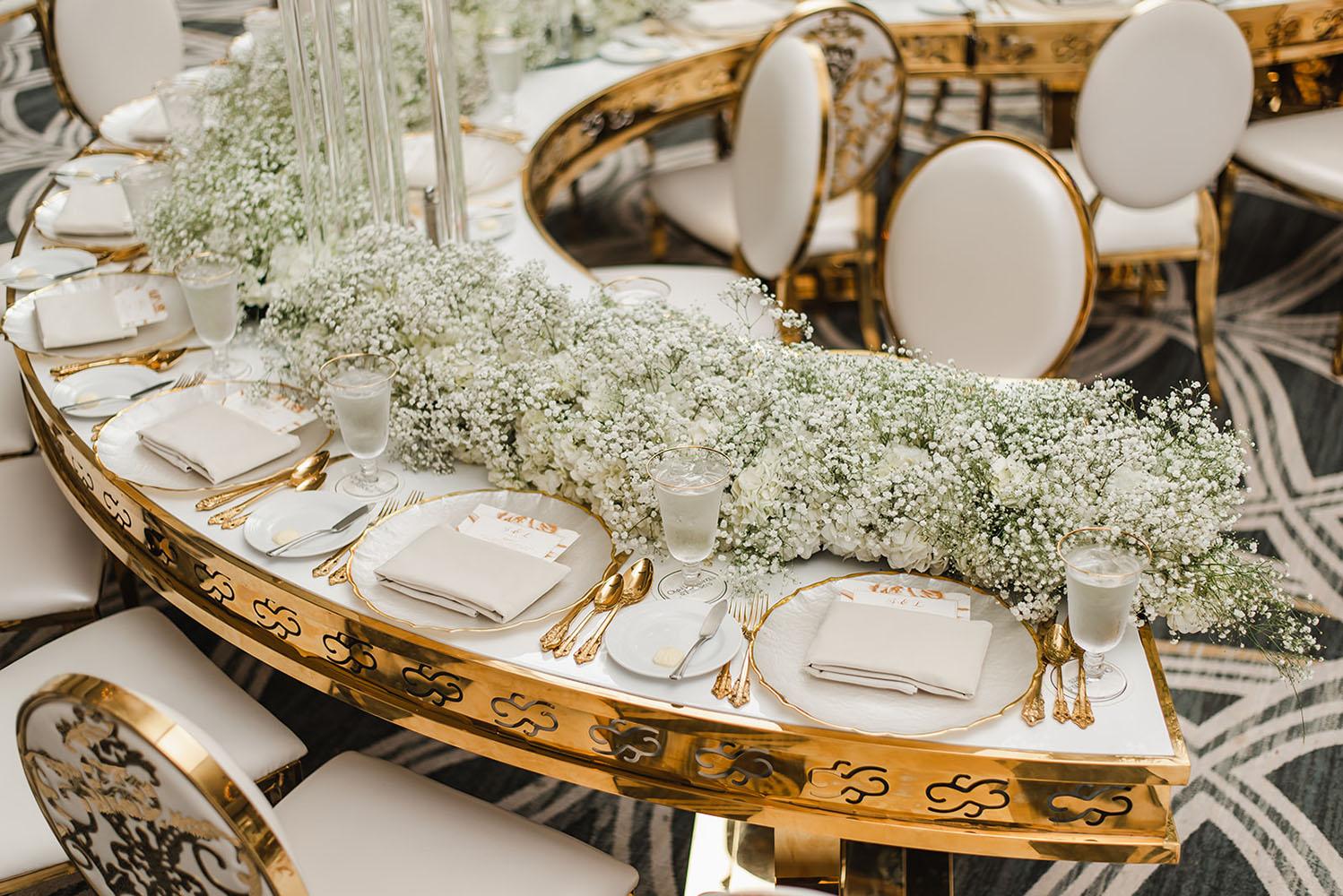 Wisteria, Baby's Breath, reception decor, omni houston, wedding decor, florist in houston, gold round table, mirror seating chart, wedding cake