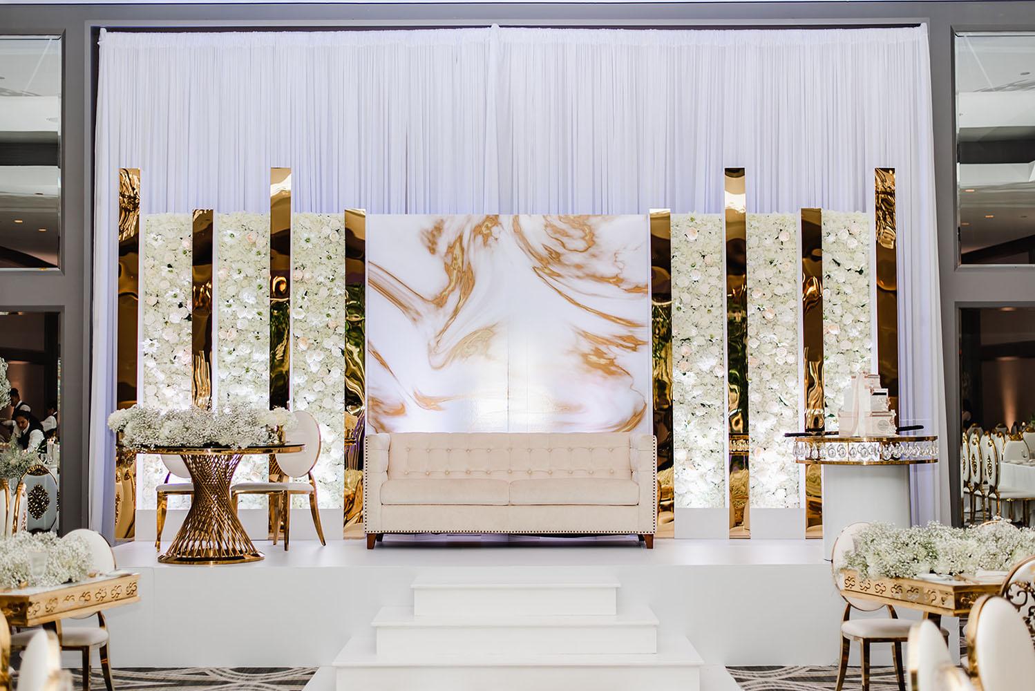 Wisteria, Baby's Breath, reception decor, omni houston, wedding decor, florist in houston, gold round table, mirror seating chart, wedding cake