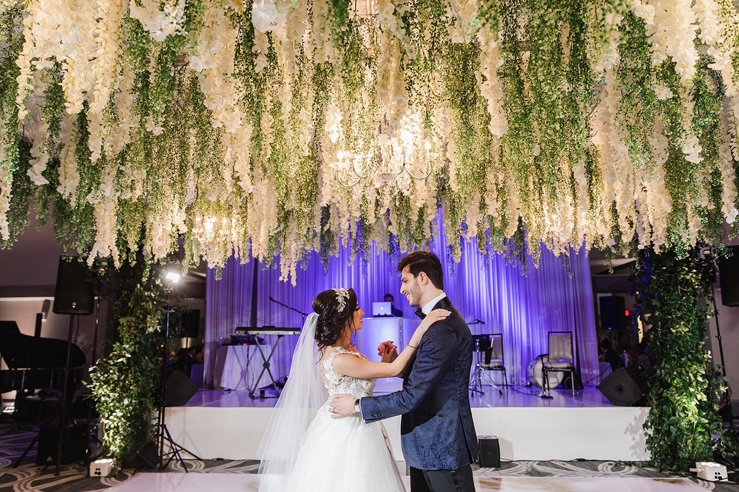 Wisteria, Baby's Breath, reception decor, omni houston, wedding decor, florist in houston, gold round table, mirror seating chart, wedding cake
