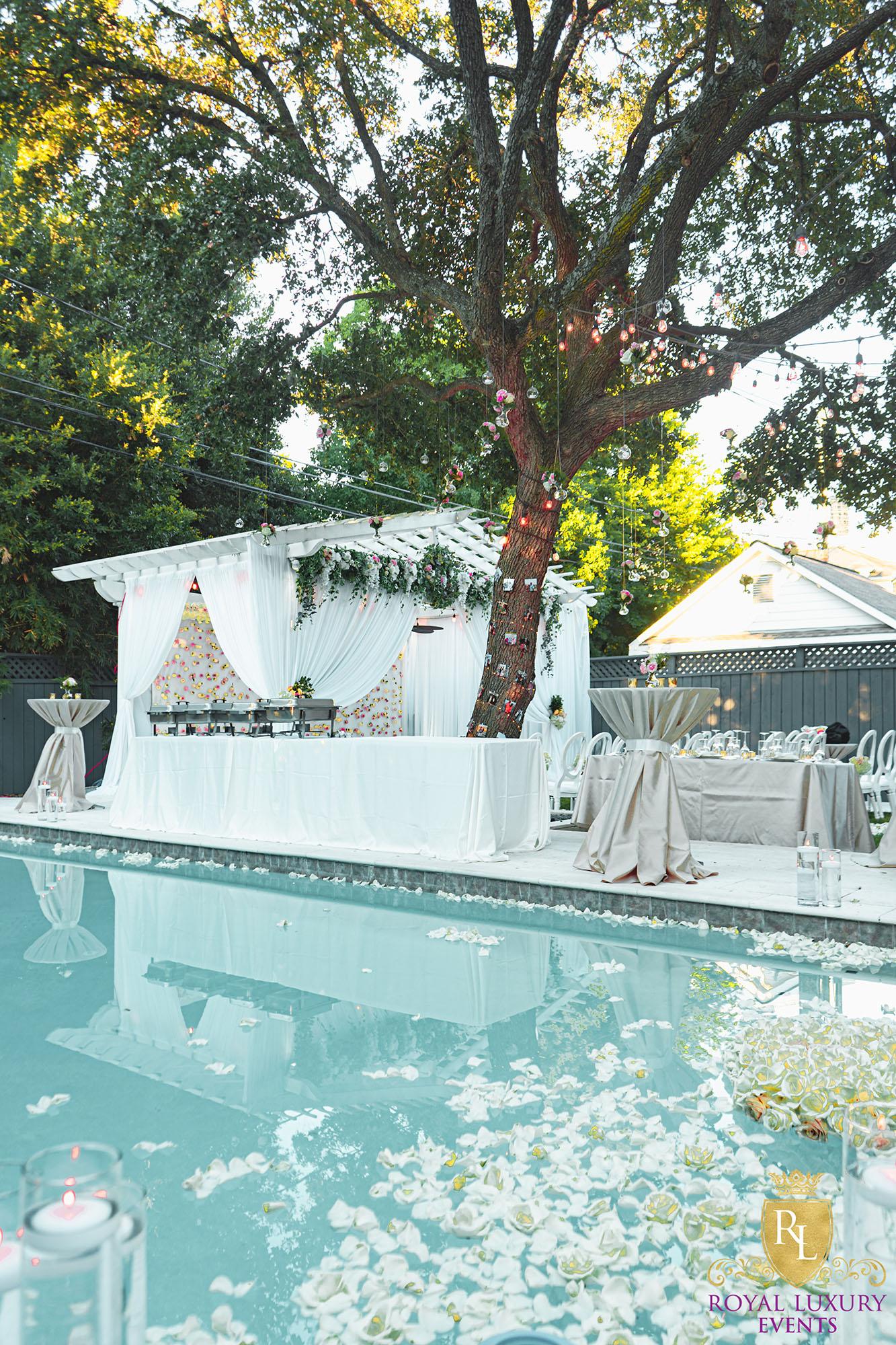 intimate backyard wedding decor featured pastel florals, white chairs, a greenery wall, and many other unique details - houston wedding decor