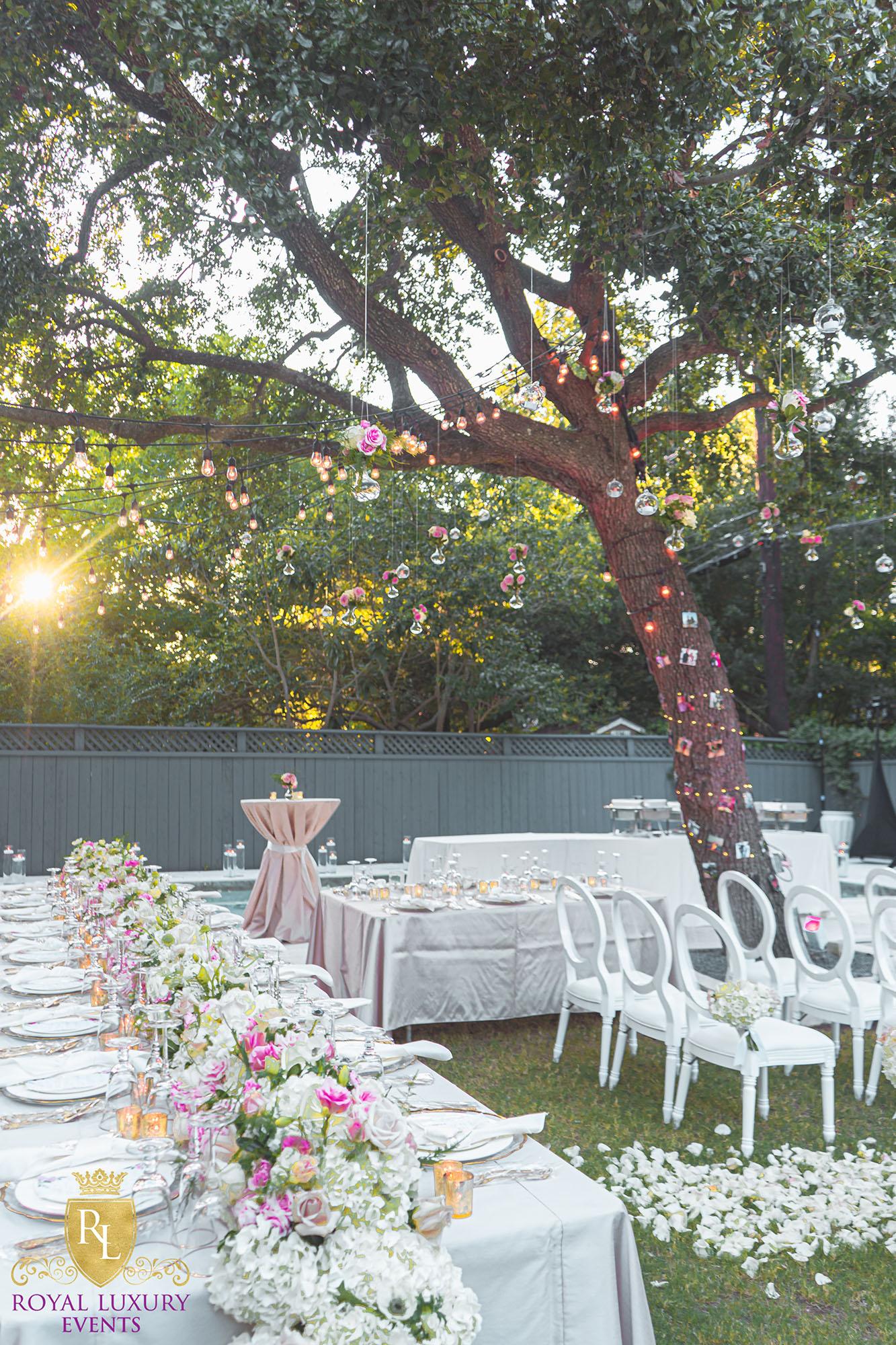 intimate backyard wedding decor featured pastel florals, white chairs, a greenery wall, and many other unique details - houston wedding decor