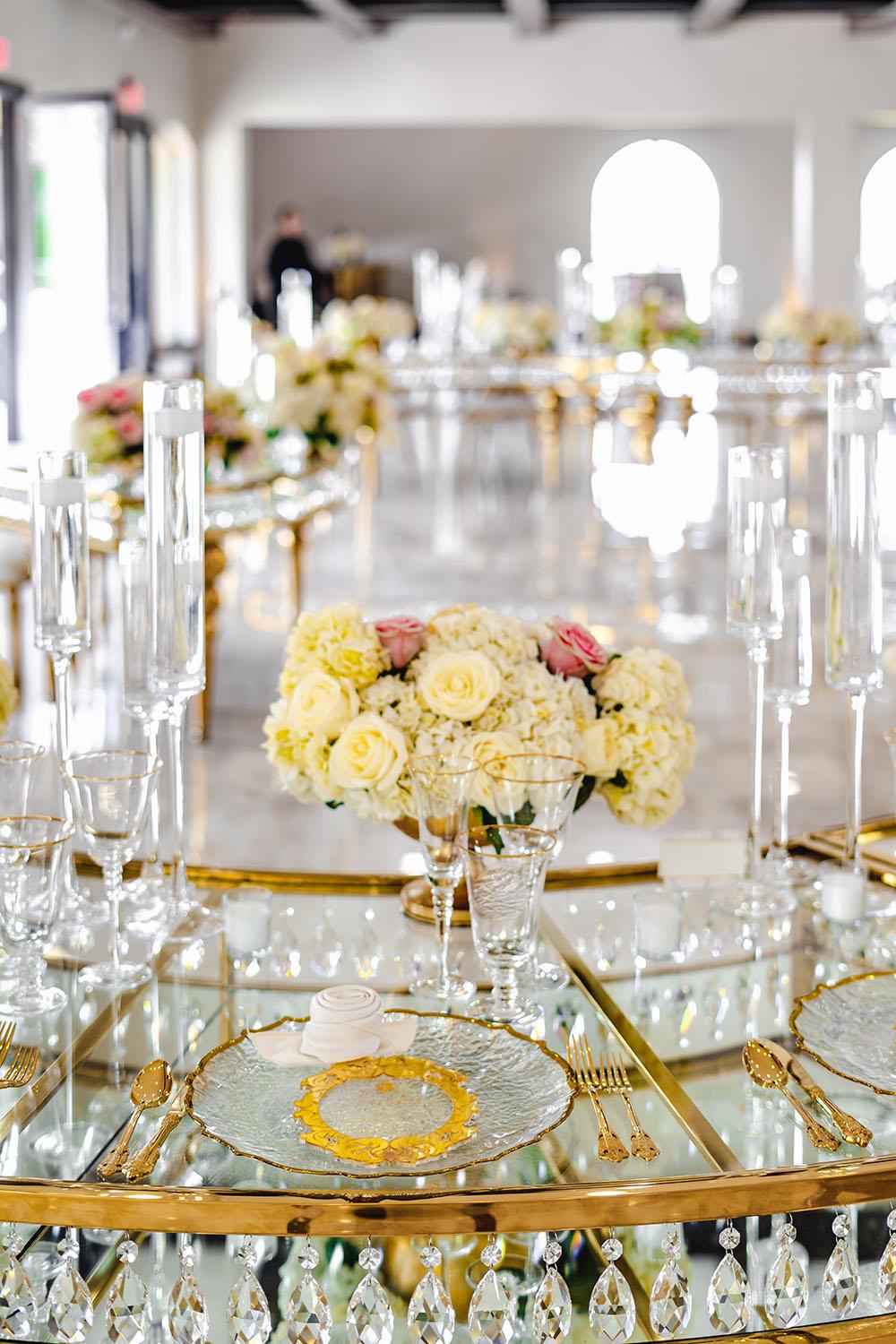 floral centerpieces on gold crystal table - palm royal villa - royal luxury events