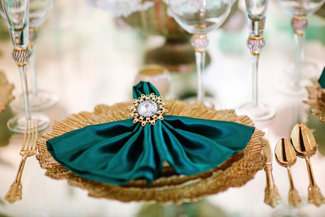 View this emerald green luxury birthday decor featuring gold crystal tables and gold chairs by Royal Luxury Events in Houston, Texas.