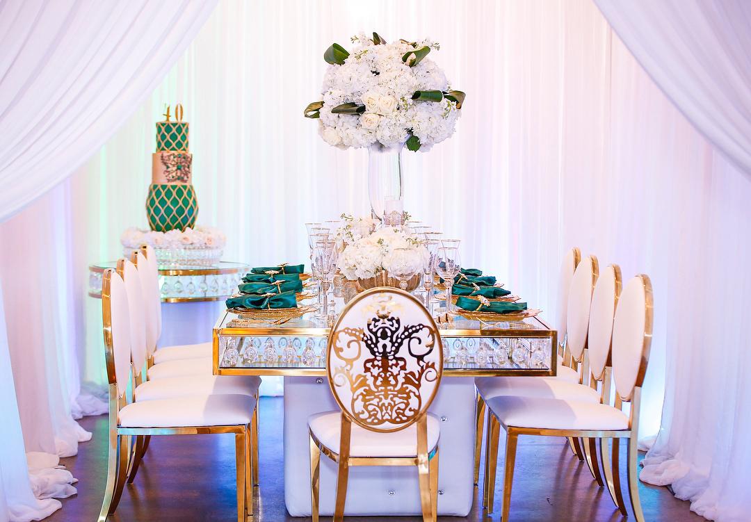View this emerald green luxury birthday decor featuring gold crystal tables and gold chairs by Royal Luxury Events in Houston, Texas.