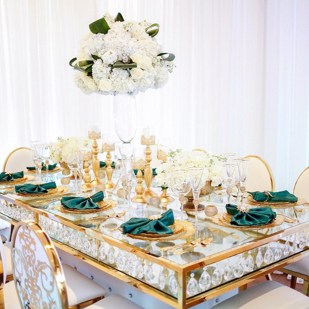 View this emerald green luxury birthday decor featuring gold crystal tables and gold chairs by Royal Luxury Events in Houston, Texas.