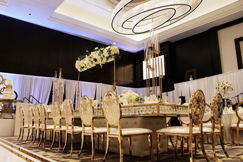 View this luxurious engagement party decor at The Post Oak Hotel at Uptown Houston. Featuring gold chairs, charger plates, & sweetheart table.