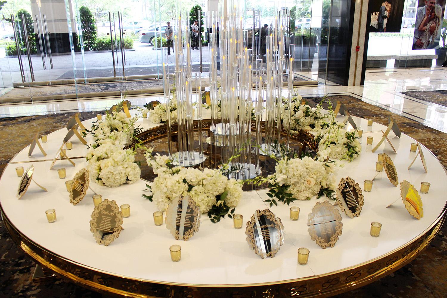View this luxurious engagement party decor at The Post Oak Hotel at Uptown Houston. Featuring gold chairs, charger plates, & sweetheart table.