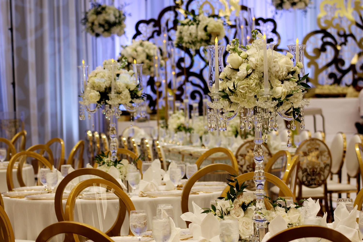 View this luxurious engagement party decor at The Post Oak Hotel at Uptown Houston. Featuring gold chairs, charger plates, & sweetheart table.