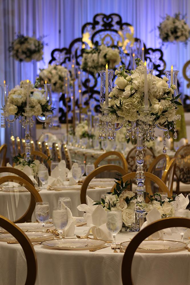 View this luxurious engagement party decor at The Post Oak Hotel at Uptown Houston. Featuring gold chairs, charger plates, & sweetheart table.