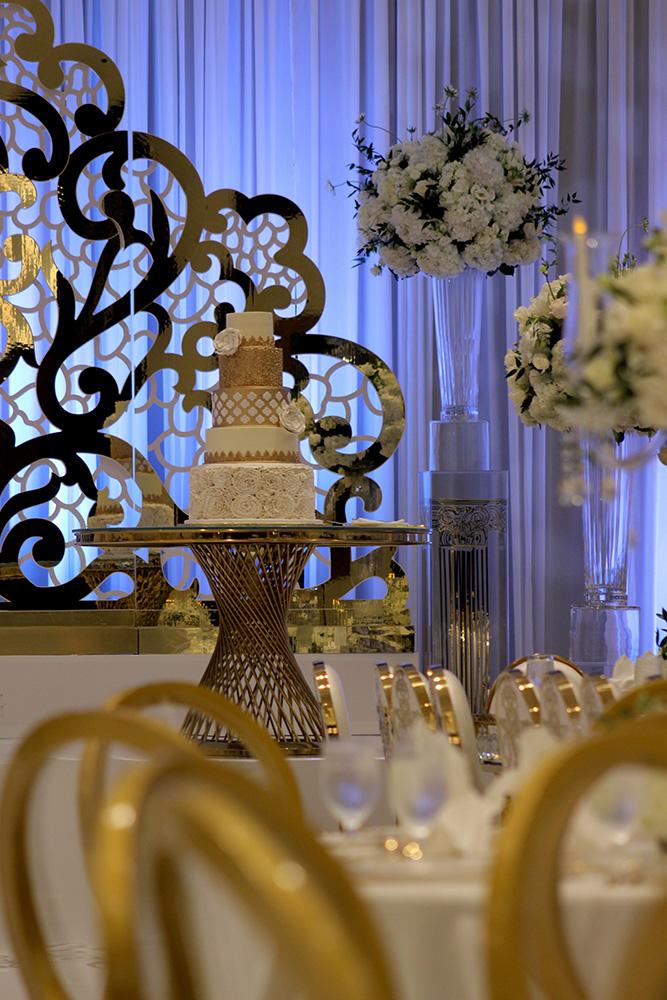 View this luxurious engagement party decor at The Post Oak Hotel at Uptown Houston. Featuring gold chairs, charger plates, & sweetheart table.