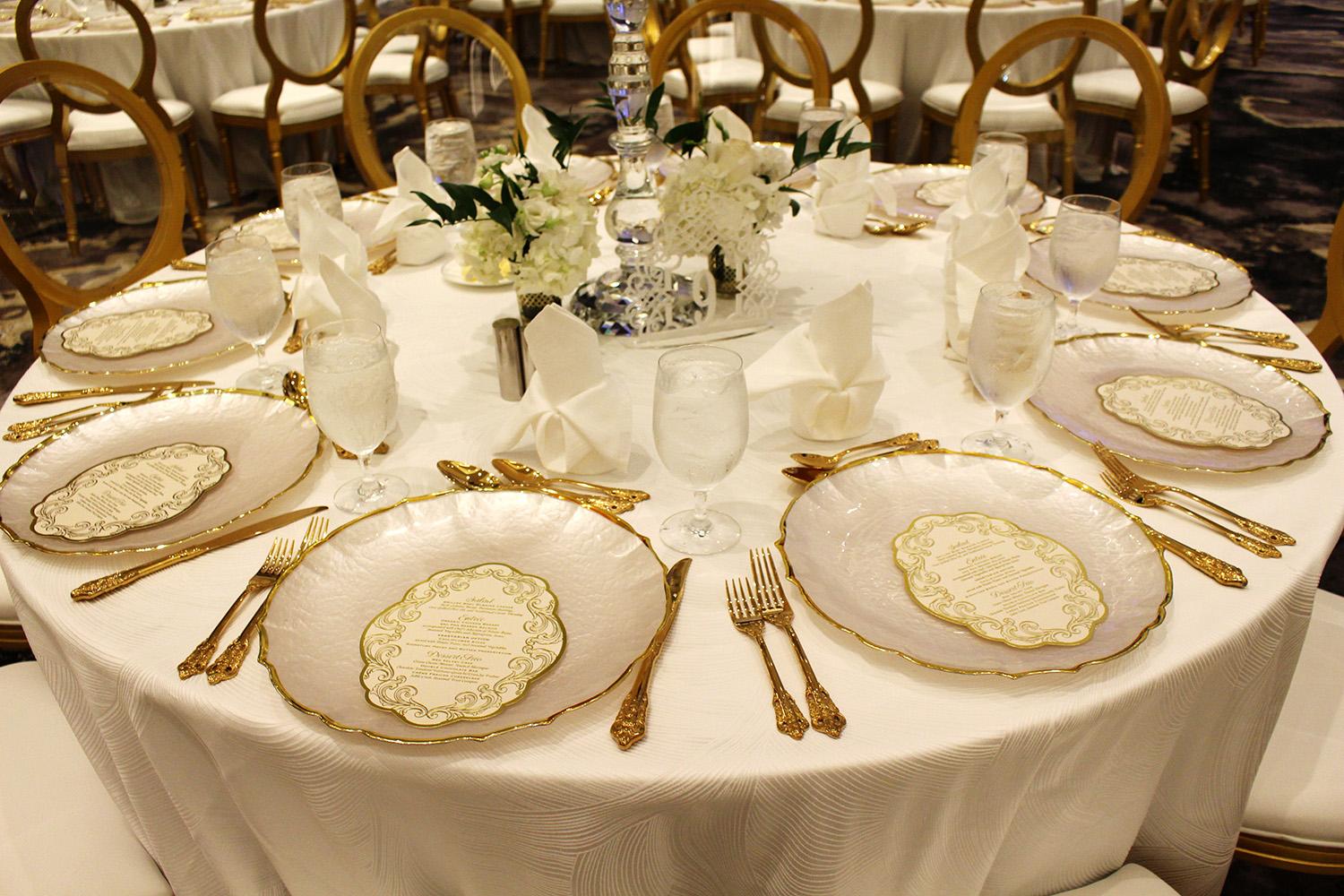 View this luxurious engagement party decor at The Post Oak Hotel at Uptown Houston. Featuring gold chairs, charger plates, & sweetheart table.