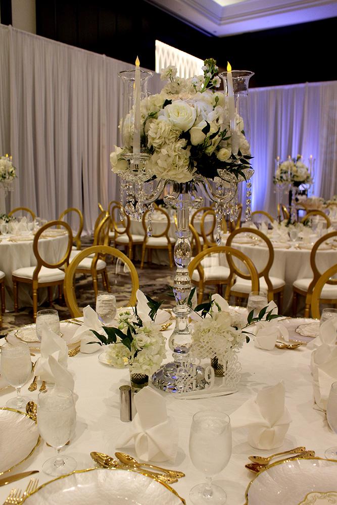 View this luxurious engagement party decor at The Post Oak Hotel at Uptown Houston. Featuring gold chairs, charger plates, & sweetheart table.