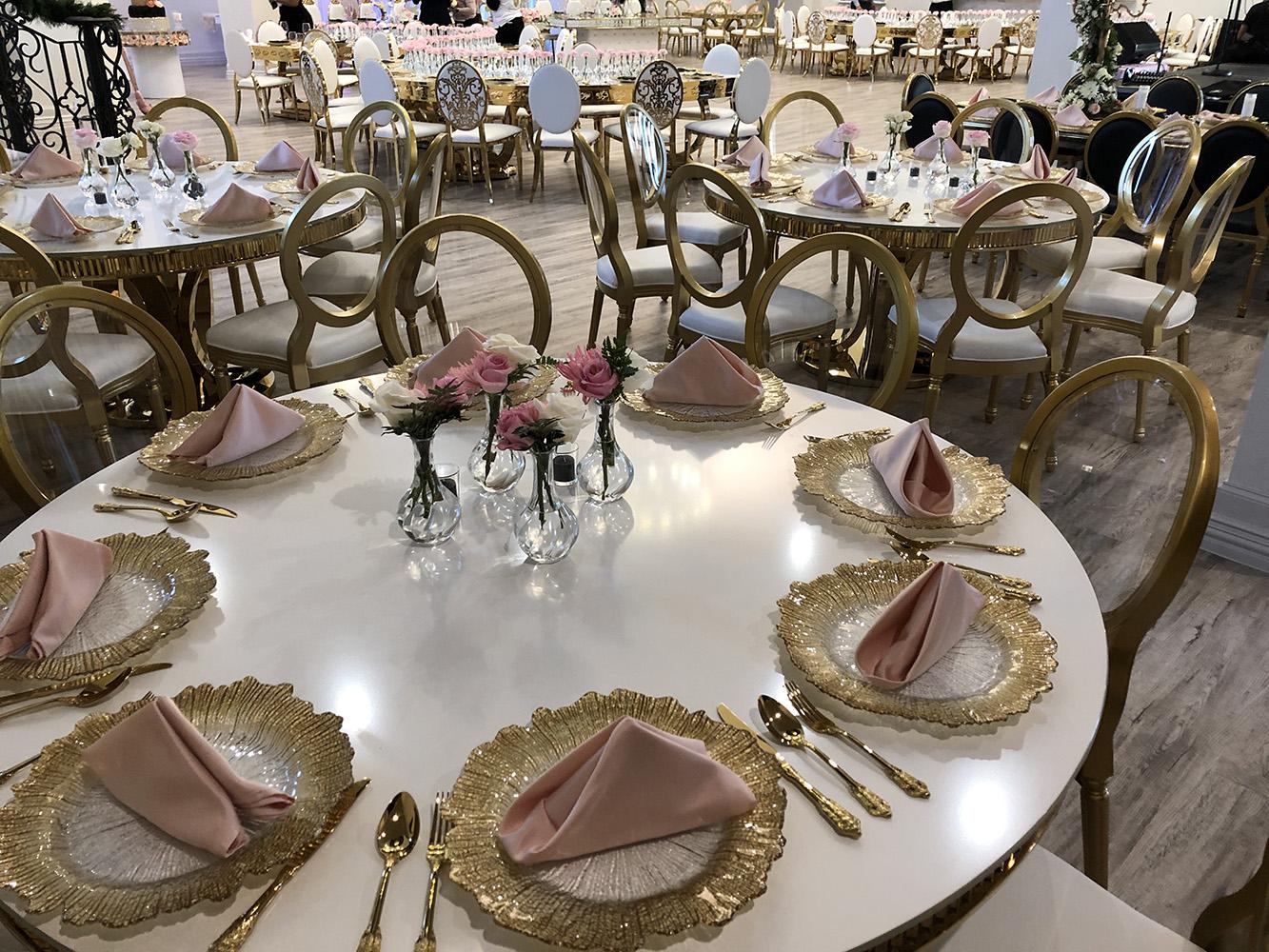 Knotting Hill Place in Dallas, Texas by Royal Luxury Events. Featuring our black and gold chairs, serpentine table, gold crystal tables, white and gold chairs, backdrops and more.