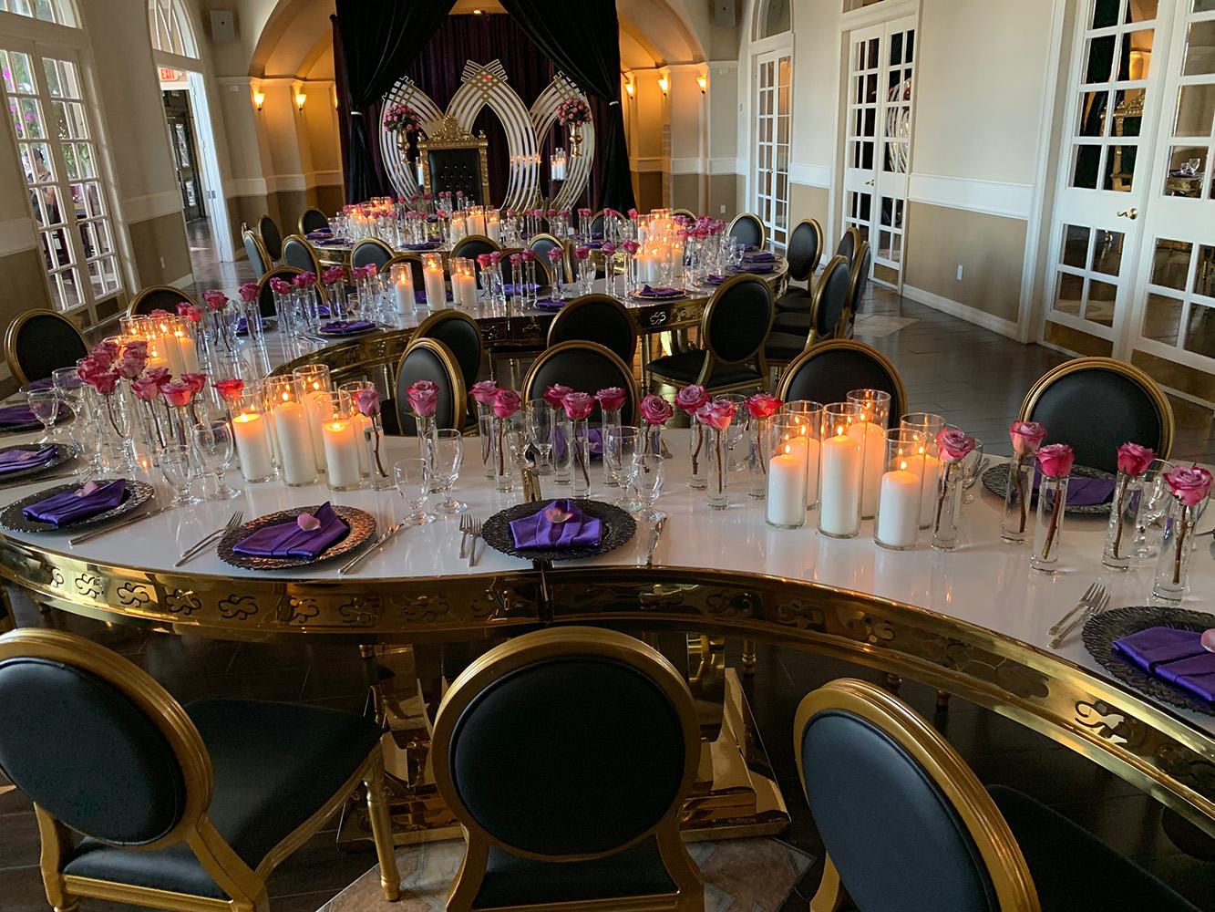 rehearsal dinner - black chairs - purple napkins - pink flowers - backdrop - bougainvilleas