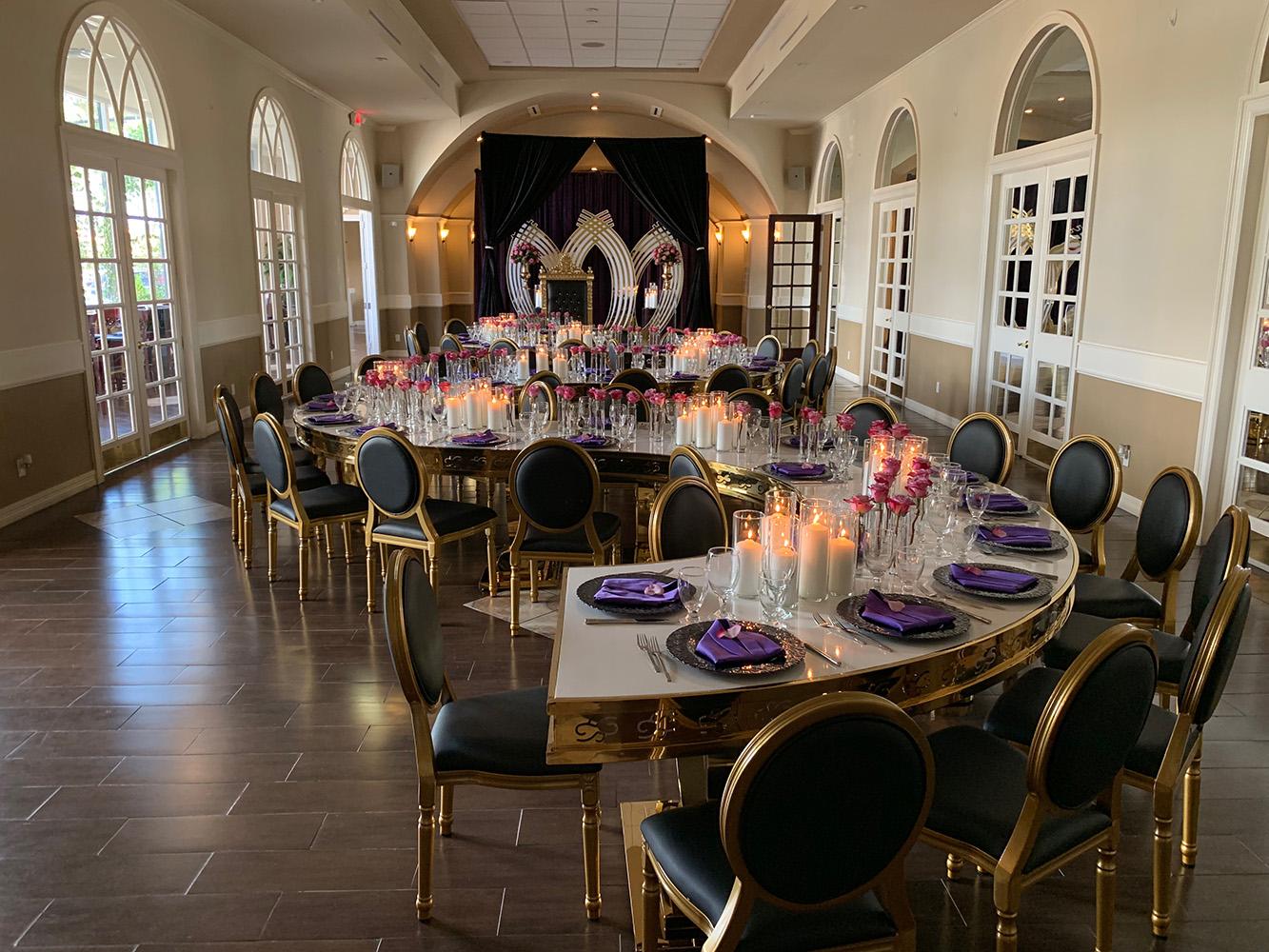 rehearsal dinner - black chairs - purple napkins - pink flowers - backdrop - bougainvilleas
