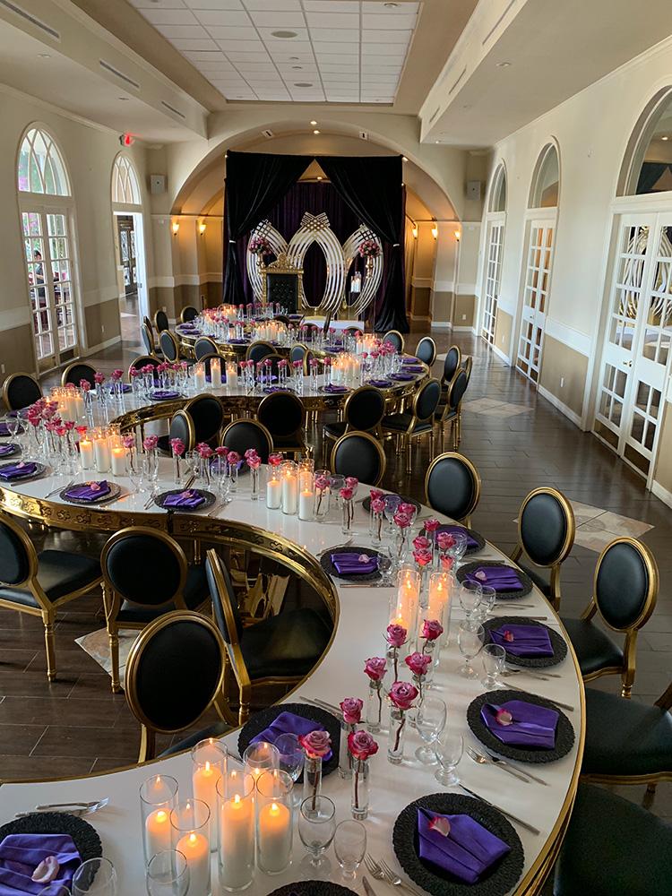 rehearsal dinner - black chairs - purple napkins - pink flowers - backdrop - bougainvilleas