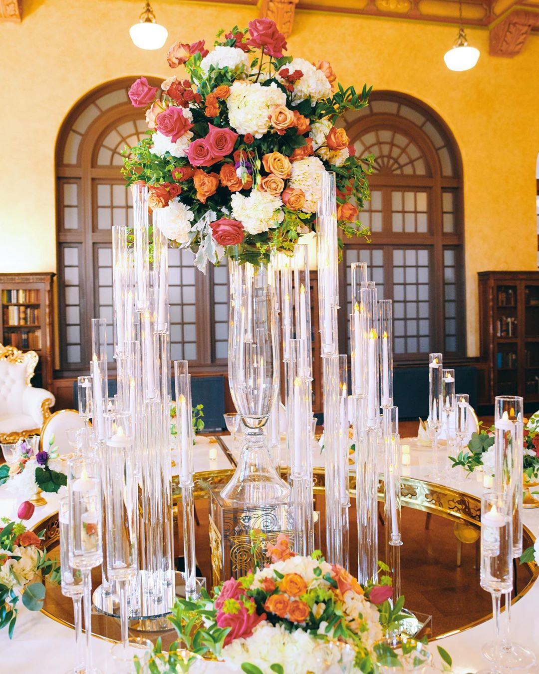 luxury wedding decor for weddings in houston at julia ideson library - gold chairs - long tables - clear vases