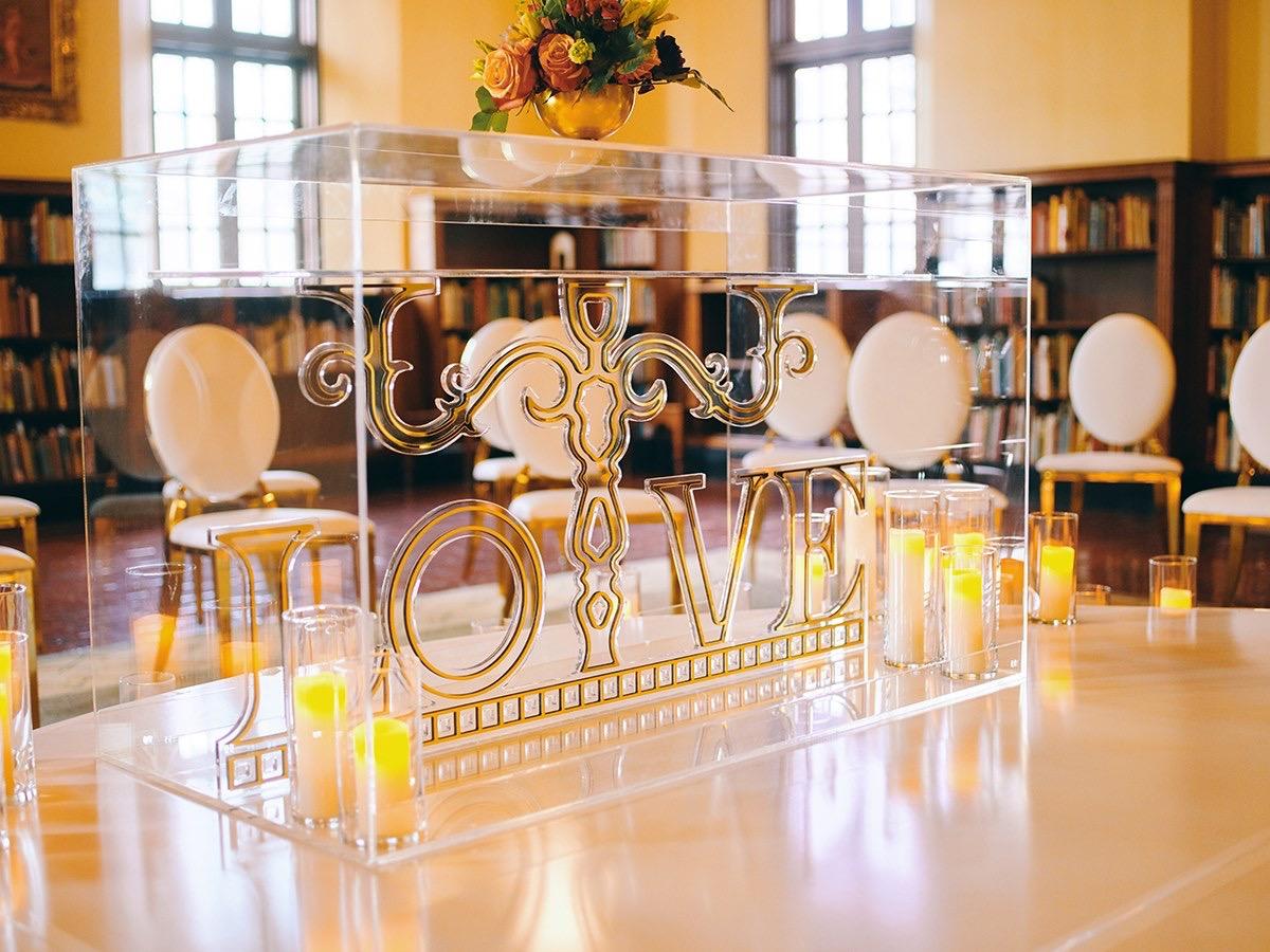 luxury wedding decor for weddings in houston at julia ideson library - gold chairs - long tables - clear vases