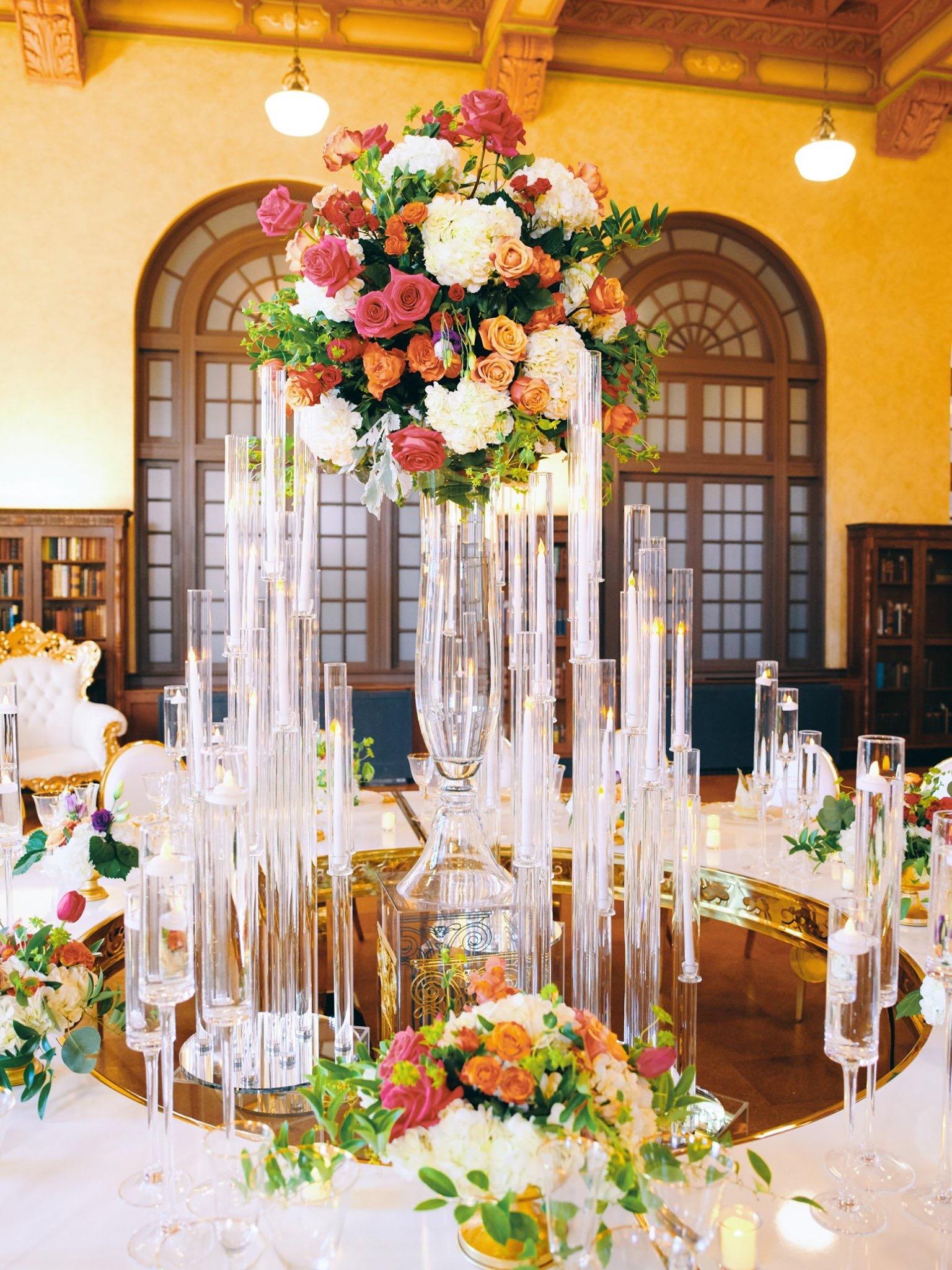 luxury wedding decor for weddings in houston at julia ideson library - gold chairs - long tables - clear vases