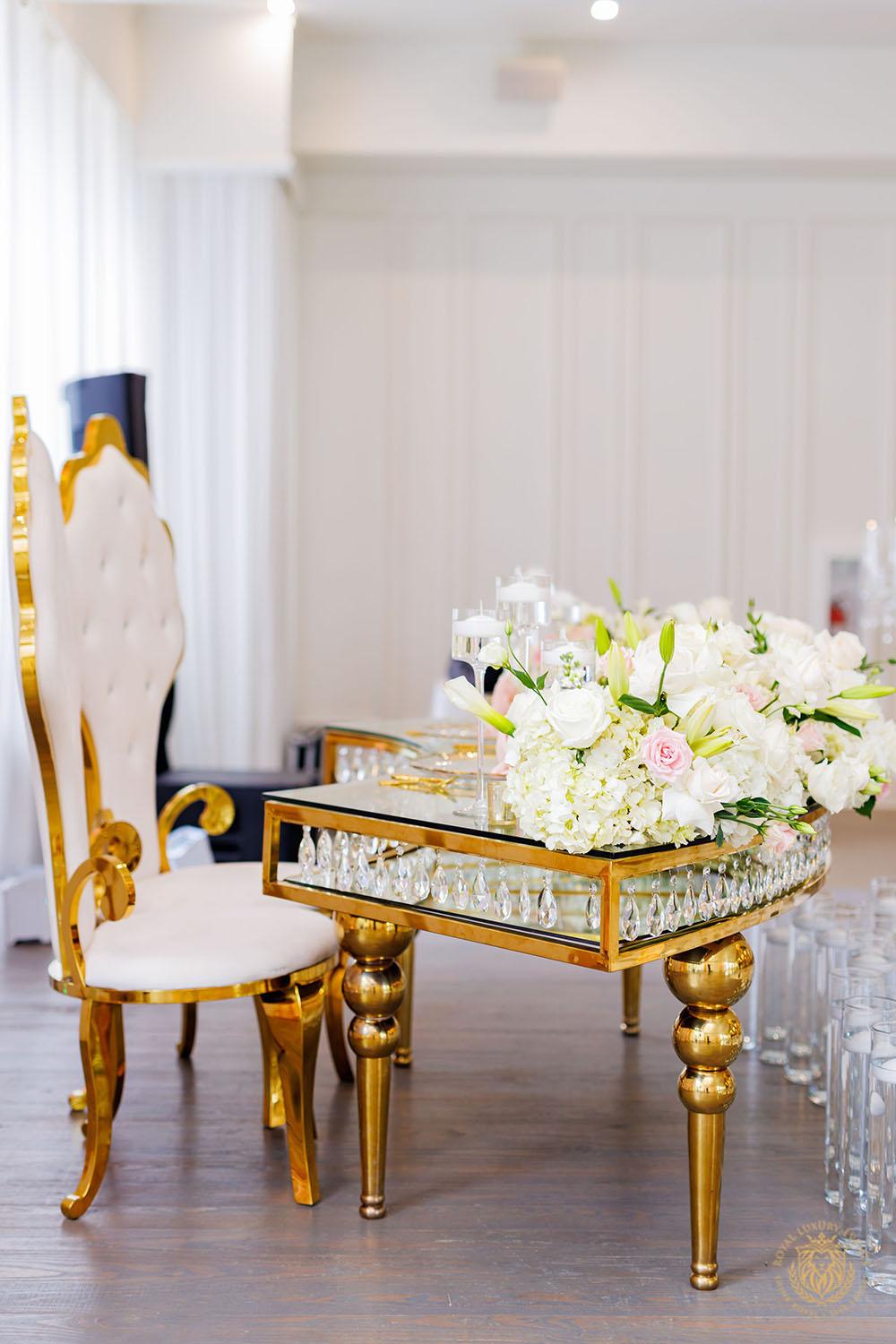 sweetheart table - gold and white chair rentals