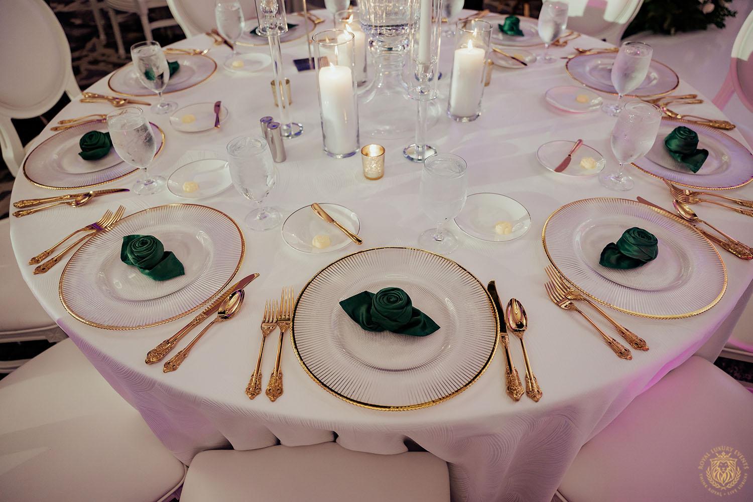 glass charger rentals - houston wedding rentals - gold flatware - emerald linens