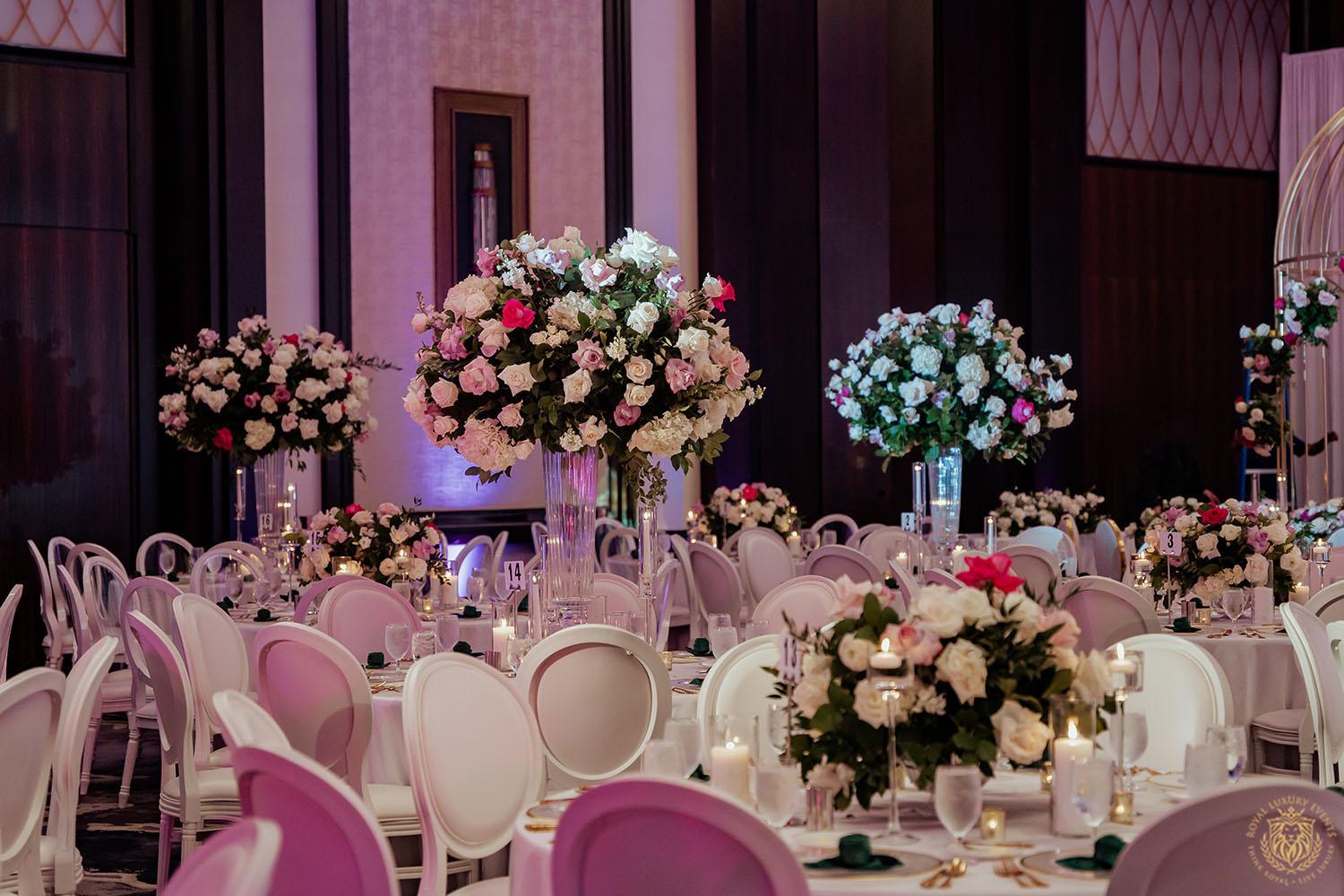 floral designer in houston - ivory flowers - pink flowers - tall floral centerpieces - low floral centerpieces - wedding centerpieces - white chair rentals
