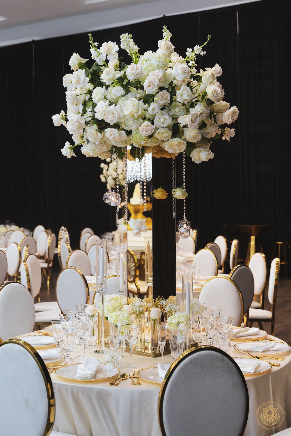 tall floral centerpieces, gold mirrored flower stand, white wedding flowers