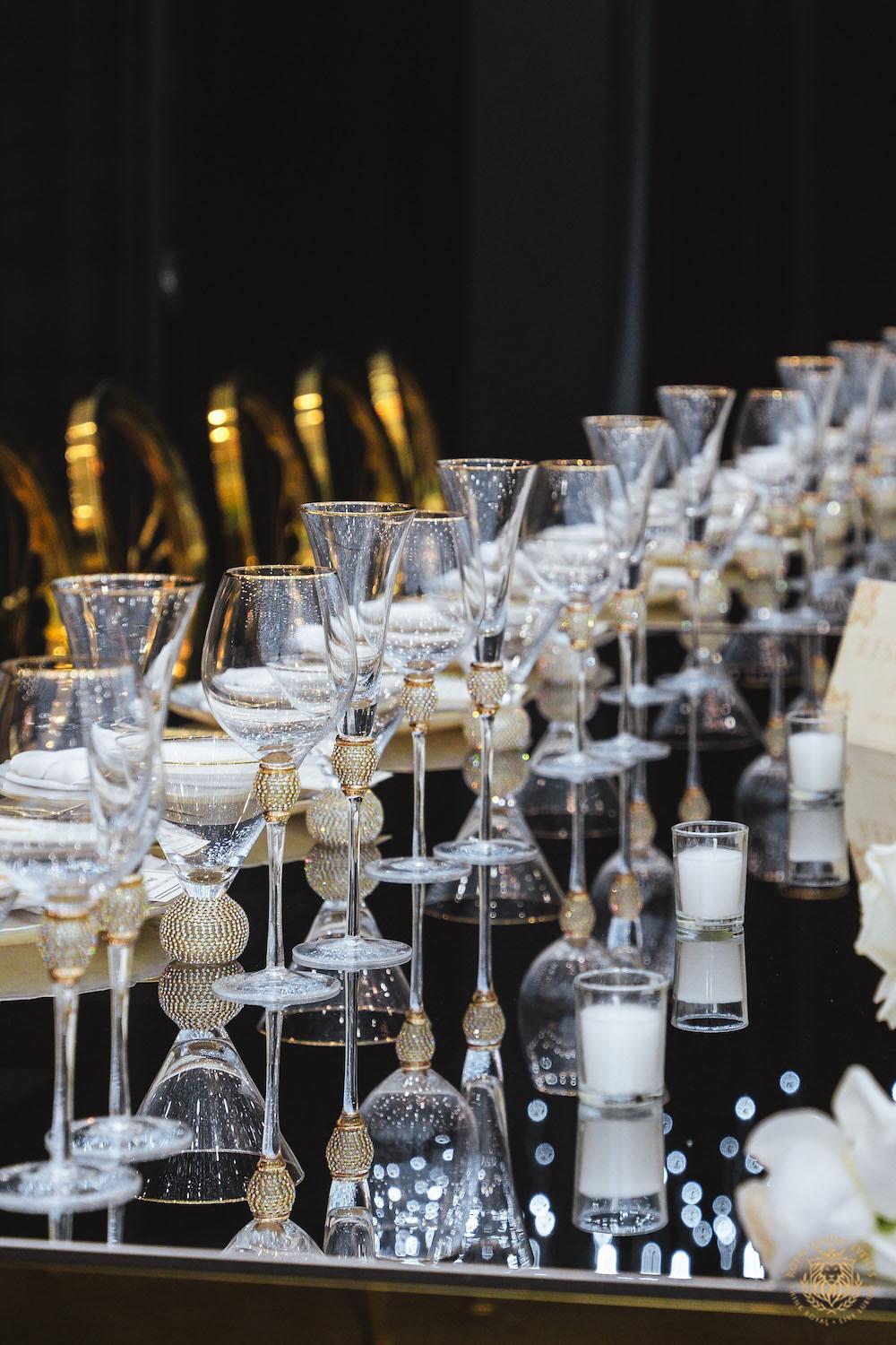 mirrored table top rental, gold and white chargers, wedding tablescape, luxury wedding place setting