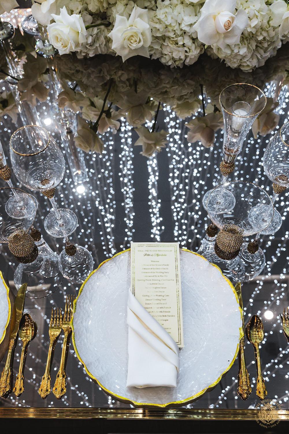 mirrored table top rental, gold and white chargers, wedding tablescape, luxury wedding place setting