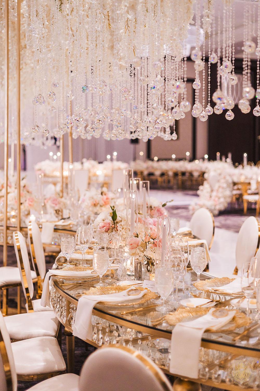 serpentine crystal table, unique wedding centerpieces, wedding reception decor, wedding chairs, white and gold chair rentals, tablescape, wedding place setting