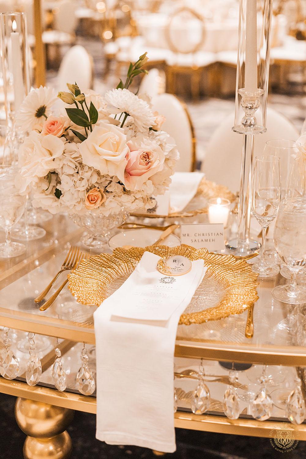 gold chargers, tablescape, wedding place setting, low floral centerpieces, gold flatware