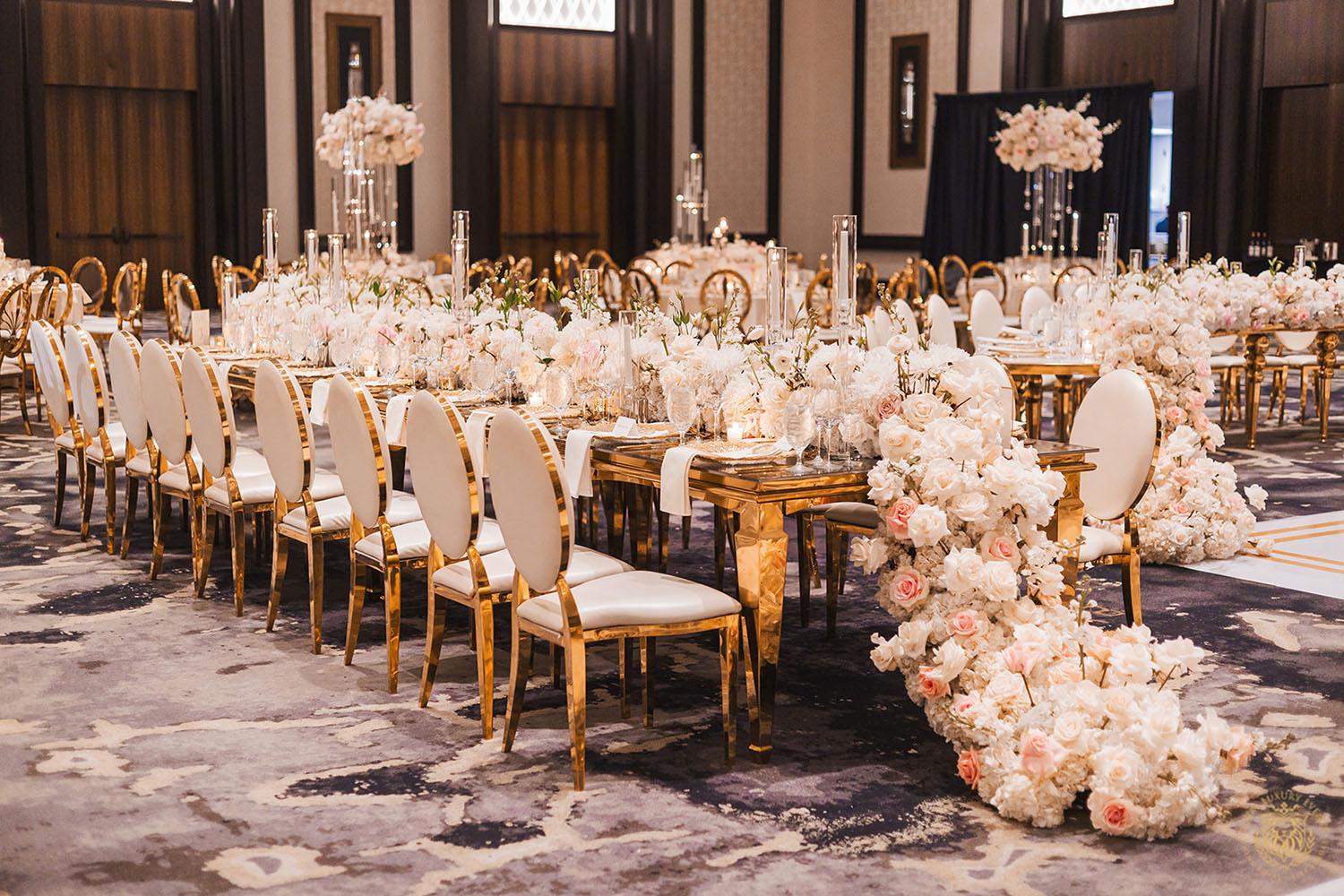 gold rectangle table, floral runner, wedding floral centerpieces, gold and white chair rentals, luxury wedding, wedding decor, wedding reception
