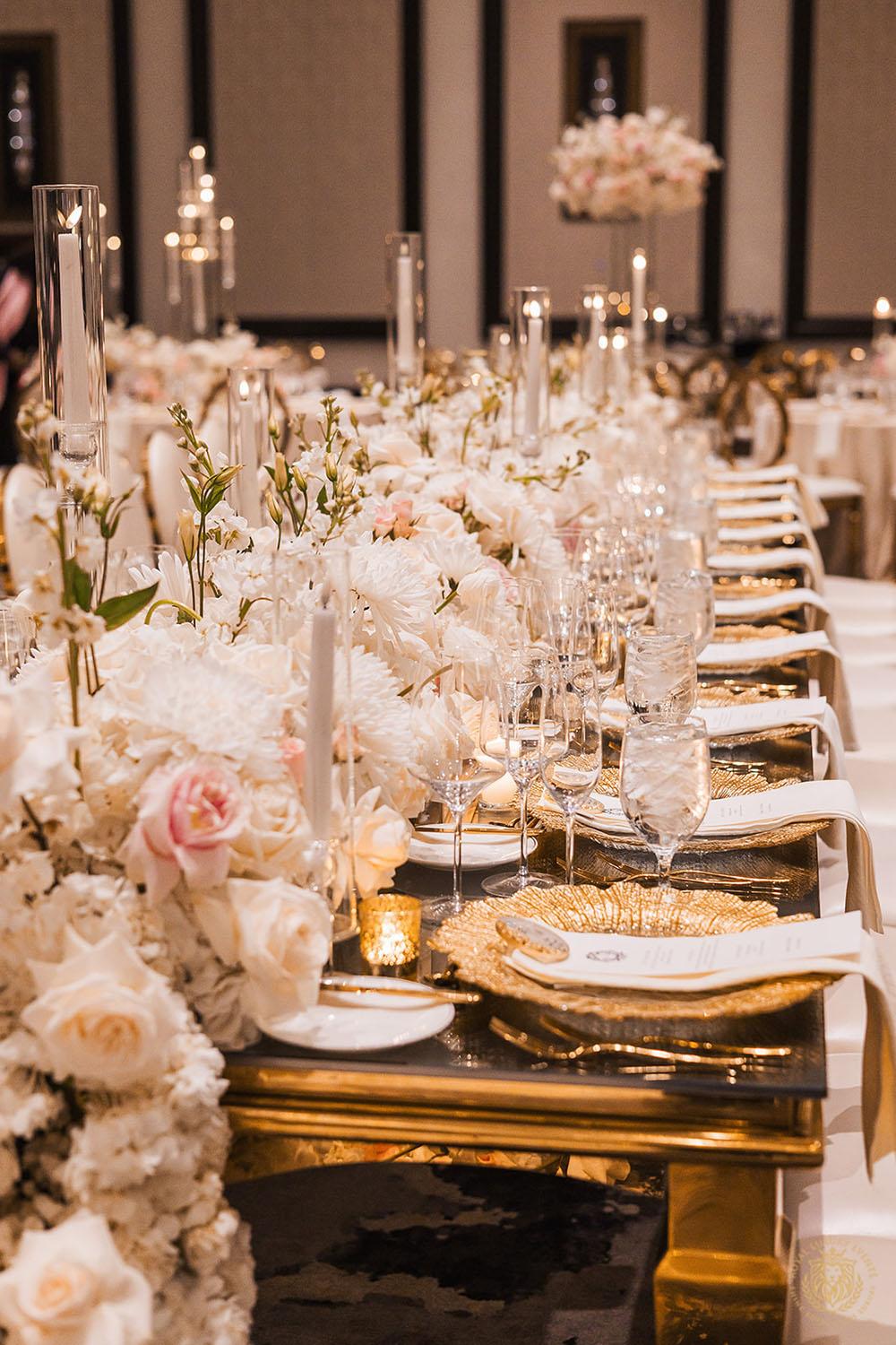 gold chargers, tablescape, wedding place setting, low floral centerpieces, gold flatware