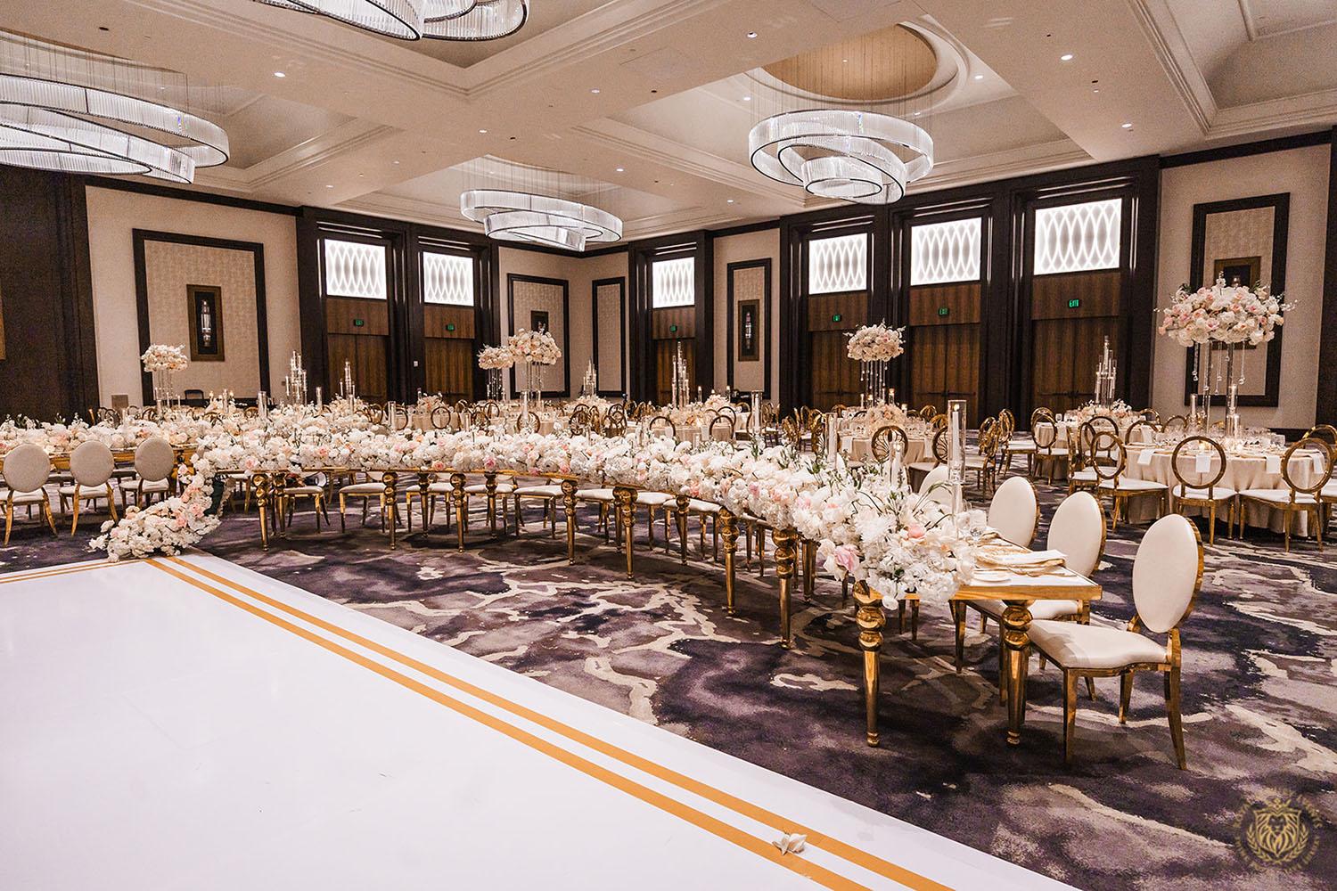 curved white and gold table, wedding layout, wedding design, gold and white wedding, wedding dance floor, white and gold chairs, luxury wedding rentals