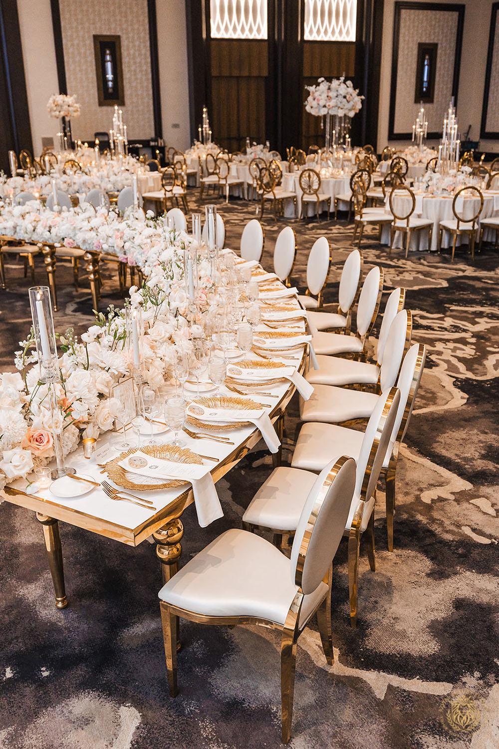 curved white and gold table, wedding layout, wedding design, gold and white wedding, wedding dance floor, white and gold chairs, luxury wedding rentals