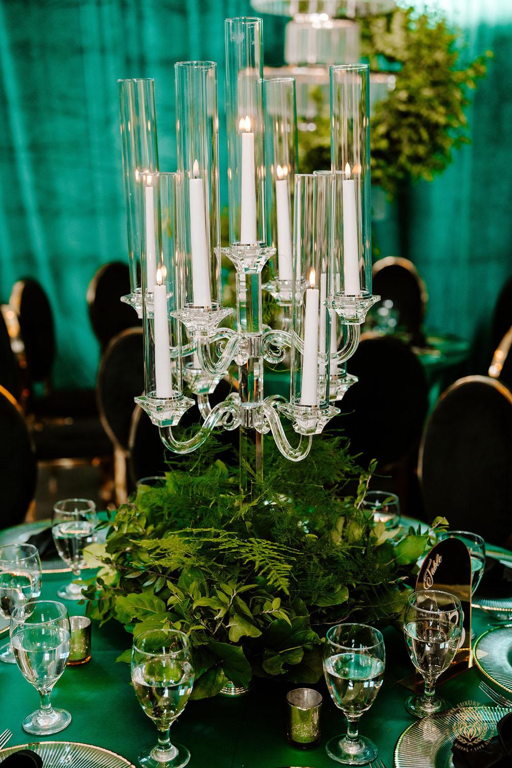 event decor, quinceañera theme, quinceañera ideas, candelabras, luxury events, event designer, emerald, black, gold, greenery, florist, floral design, tall centerpieces, black and gold chairs, luxury chair rentals