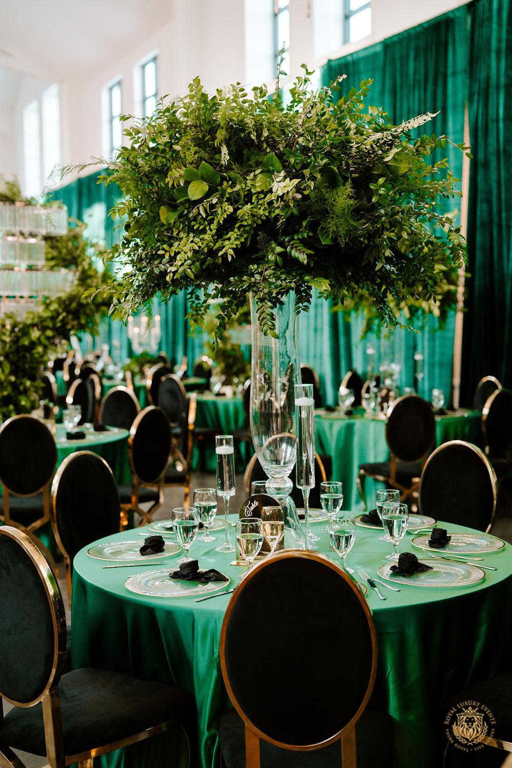quinceañera decor, quinceañera theme, quinceañera ideas, luxury events, event designer, emerald, black, gold, greenery, florist, floral design, tall centerpieces, black and gold chairs, luxury chair rentals