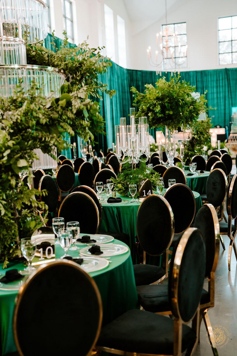 quinceañera decor, quinceañera theme, quinceañera ideas, luxury events, event designer, emerald, black, gold, greenery, florist, floral design, tall centerpieces, black and gold chairs, luxury chair rentals
