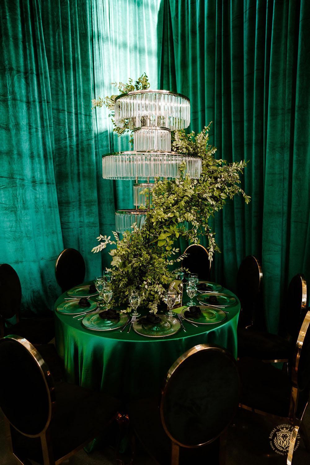 quinceañera decor, quinceañera theme, quinceañera ideas, luxury events, event designer, emerald, black, gold, greenery, florist, floral design, tall centerpieces, black and gold chairs, luxury chair rentals