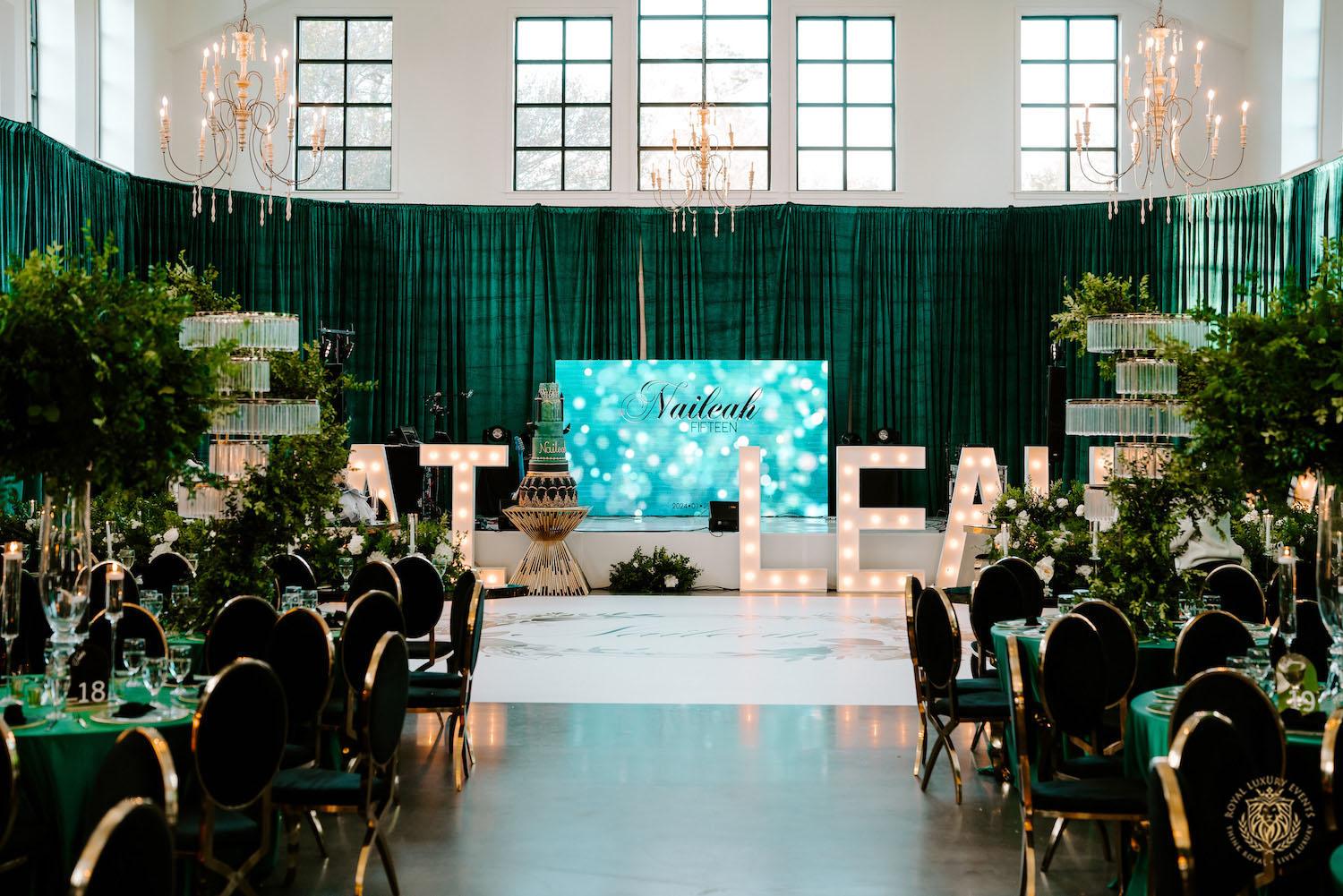 quinceañera, houston events, quinceañera theme, quinceañera ideas, luxury events, event designer, emerald, black, gold, greenery, florist, floral design, tall centerpieces, black and gold chairs, luxury chair rentals, emerald decor, draping backdrop