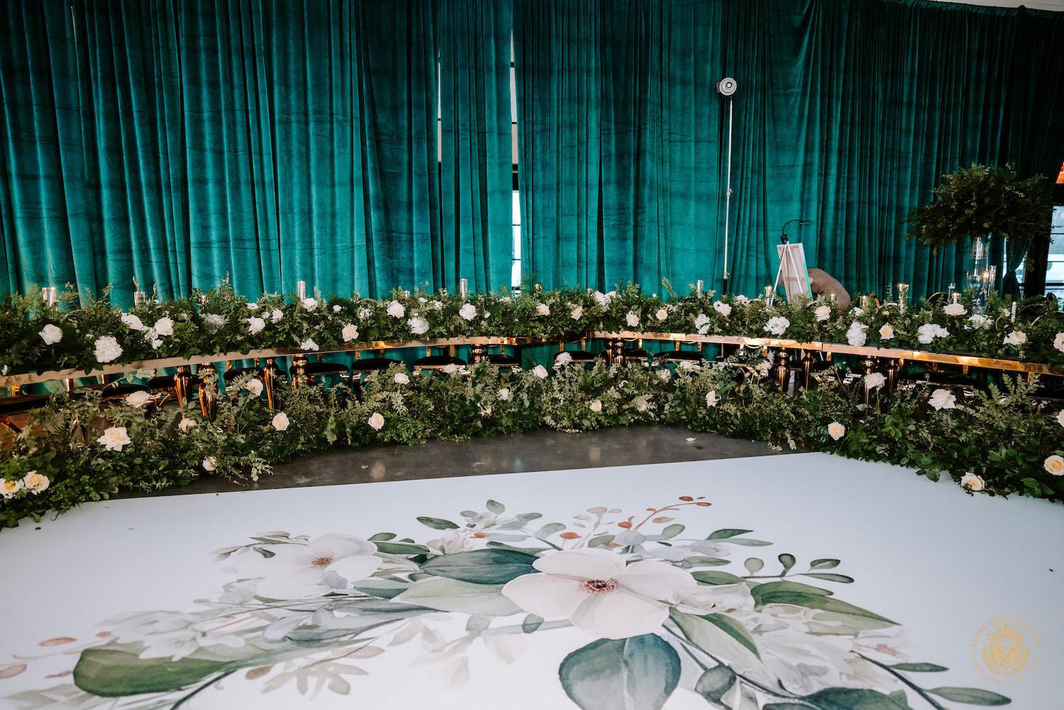 quinceañera, luxury events, event designer, emerald, black, gold, ivory flowers, greenery, florist, floral design, tall centerpieces, black and gold chairs, luxury chair rentals, emerald decor, draping backdrop