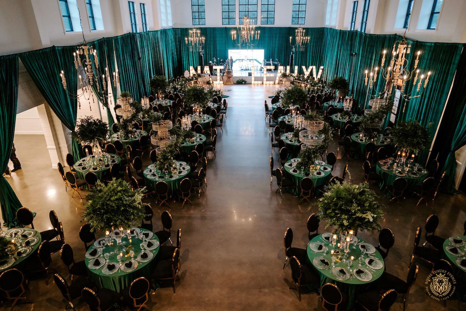 quinceañera, houston events, quinceañera theme, quinceañera ideas, luxury events, event designer, emerald, black, gold, greenery, florist, floral design, tall centerpieces, black and gold chairs, luxury chair rentals, emerald decor, draping backdrop