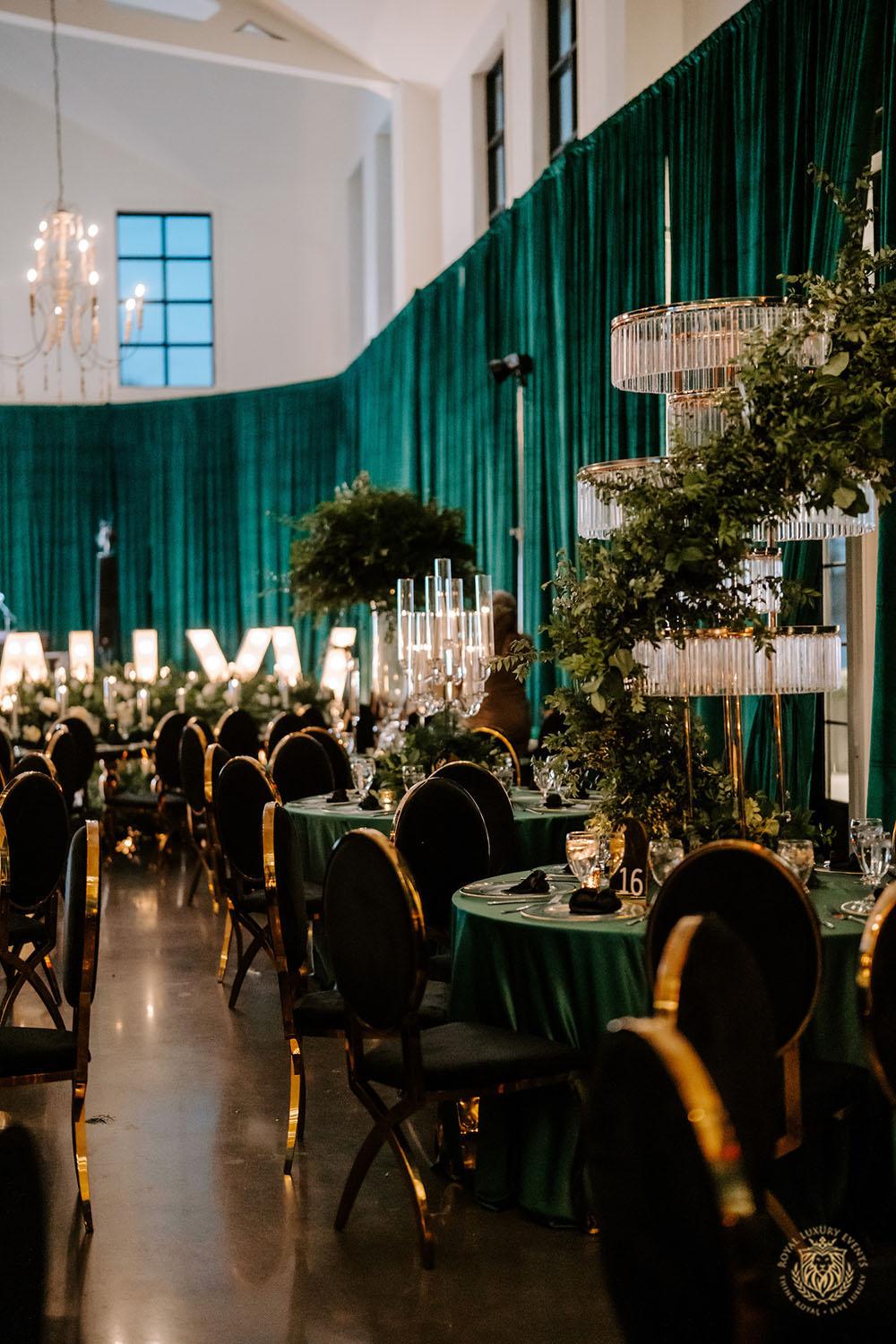 quinceañera, houston events, quinceañera theme, quinceañera ideas, luxury events, event designer, emerald, black, gold, greenery, florist, floral design, tall centerpieces, black and gold chairs, luxury chair rentals, emerald decor, draping backdrop