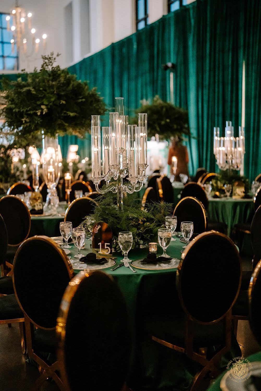quinceañera, houston events, event design, event decor, candelabras, luxury events, event designer, emerald, black, gold, greenery, florist, floral design, tall centerpieces, black and gold chairs, luxury chair rentals, emerald decor, draping backdrop