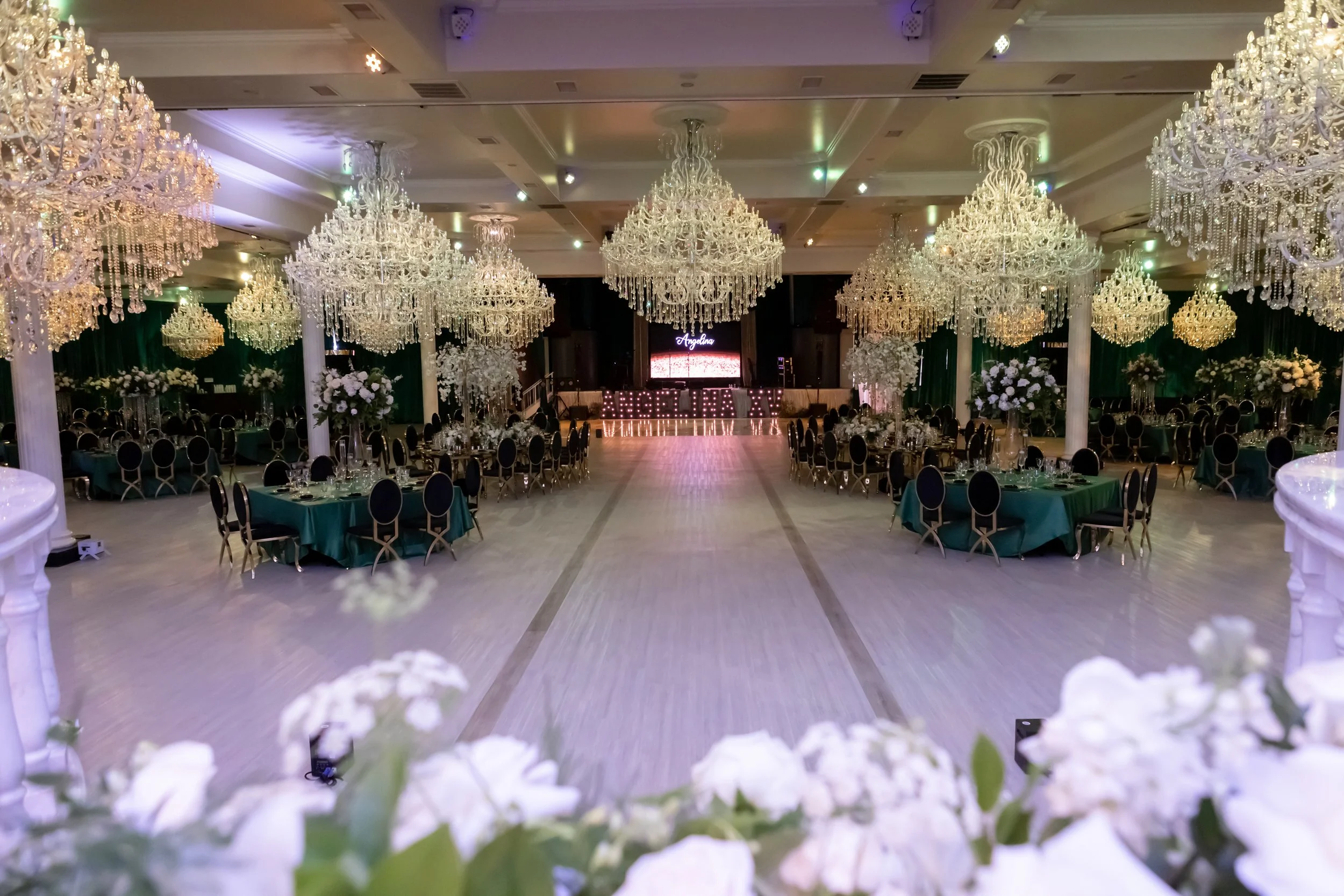 Emerald and black quinceañera with gold accents
