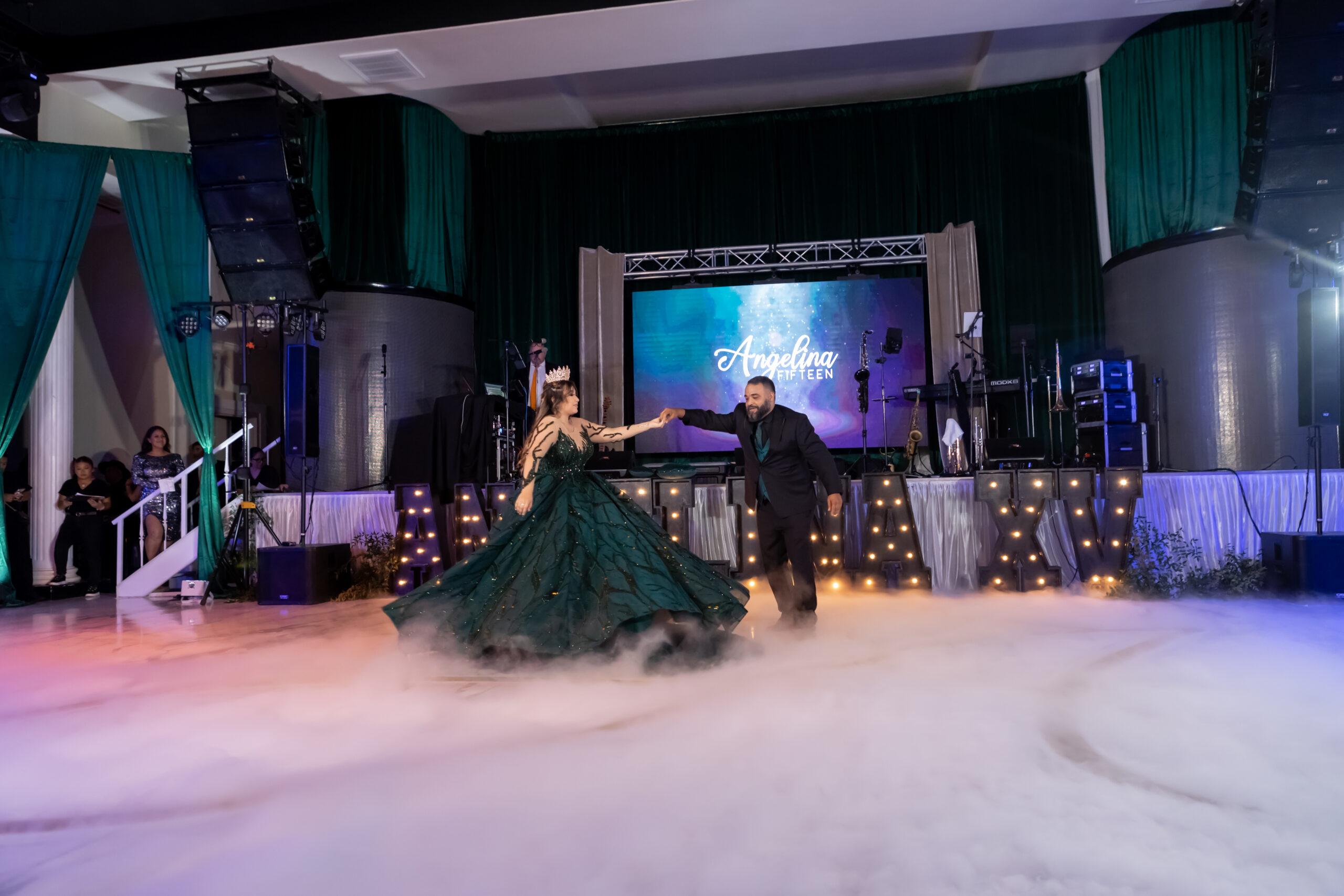 Emerald and black quinceañera with gold accents